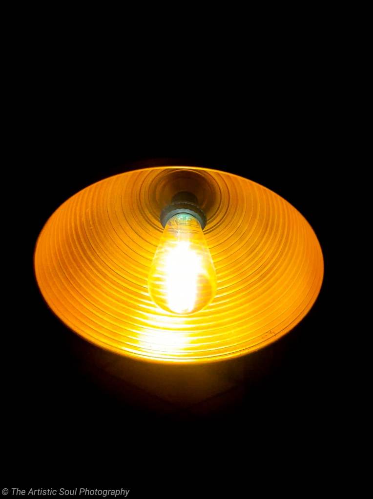 A yellow florescent bulb