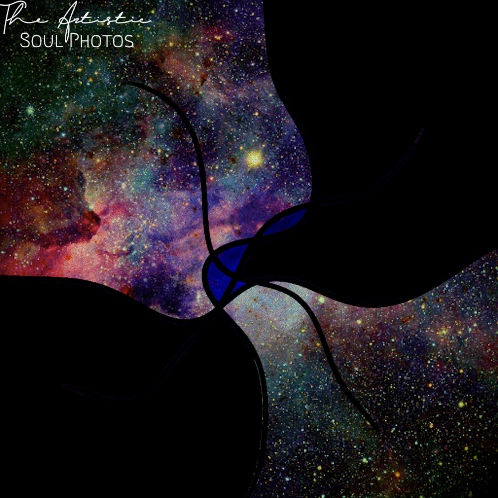 Two people kissing under the galaxies